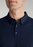A navy short sleeve polo shirt for men with a classic collar and button placket, featuring a logo.