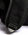 A close-up of a black backpack featuring a textured fabric and a metal buckle detail. The backpack has an integrated logo.