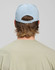 A light blue Jacquard Texture 5 Panel Cap seen from the back, featuring an adjustable strap and a logo.