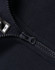 A close-up of a navy 1/2 zip collar fleece sweatshirt featuring a zipper and a tag.