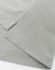 A close-up of a grey high-performance polo shirt, highlighting the fabric texture and neatly stitched hems.