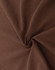A close-up of brown fabric displaying a smooth, soft texture with a swirling pattern. There is a branding logo visible.
