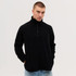 A black polar fleece 1/4 zip shirt with a high collar and a zippered front, featuring a logo.