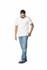 A man in a white polo shirt and blue jeans stands casually, wearing navy shoes. The shirt features a logo.