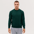 A green crew neck sweatshirt, worn by a model with a neutral expression, styled with grey sweatpants.