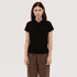 A black women's polo shirt featuring a collar and short sleeves, paired with brown trousers. It has a logo on the garment.