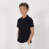 A black youth polo shirt displayed on a young model against a white background.