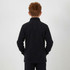 A child wearing a black polar fleece 1/4 zip top, viewed from the back with hands in pockets.