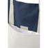 A beige tote bag with navy accents, featuring a simple design and a grey label inside the pocket.