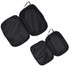 A set of three black compression packing cubes with zippers and handles for easy organisation.