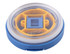 A blue and yellow lid with a clear top, designed for a food flask, featuring a central opening mechanism and branding.