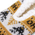 Custom knitted slippers in white, black, and mustard with a fluffy interior and patterned design. Features a logo.
