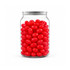 A clear jar filled with vibrant red jelly beans, featuring a shiny surface and a sleek lid.