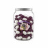 A clear jar filled with purple and white jelly beans, featuring a logo on the front.