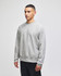 A grey Champion Reverse Weave® adult crew sweatshirt with a logo, modelled by a person.