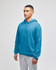 A blue pullover hooded sweatshirt with a front pocket and a logo, worn by a young man in grey sweatpants.