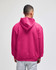 A bright pink pullover hooded sweatshirt with a relaxed fit, featuring a hood at the back.