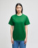 A green Champion adult short-sleeve t-shirt displayed on a model against a plain background, featuring a logo on the sleeve.
