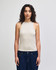 A fitted tank top in a light beige colour, featuring a high neckline and without sleeves. The model is wearing jeans.