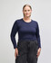 A fitted women's long sleeve crop t-shirt in navy blue, paired with high-waisted black pants. The shirt has a logo.