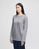 A grey Champion adult long-sleeve t-shirt displayed on a model, featuring a logo on the sleeve.