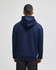 A navy hooded sweatshirt with a full zip and a back view of the model. The design includes a hood and a simple style.