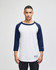 A white and navy blue raglan baseball T-shirt with three-quarter sleeves and a logo on the sleeve.