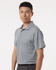 A men's polo shirt in grey featuring a collared neck and short sleeves, with a logo on the chest.