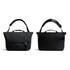 A black messenger bag with adjustable strap, featuring a flap closure and carry handles, along with a subtle logo.
