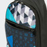 A crossbody bag featuring a geometric pattern in black, turquoise, and grey with zippered compartments and a logo.