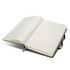 A black Moleskine 2027 Planner, featuring blank, lined pages and an elastic closure.