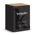 A black box with a cardboard lid containing a cloche and candle set, featuring a logo on the front.