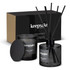 A black candle and diffuser set with whiskey and orange scent, presented in a box featuring a logo.