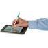 A stylus pen with a silver body and green accents is being used on a tablet screen.