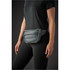 A quilted grey waist bag is worn at the waist, featuring a zippered pocket and padded design.
