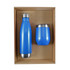 A blue drink bottle and a blue cup packaged together in a cardboard gift set. Both have a sleek design and silver accents.