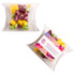 A clear pillow pack containing colourful humbugs in purple, yellow, green, and orange hues.