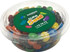 A tub filled with colourful M&Ms, featuring a mix of red, yellow, green, blue, and black candies. The tub has a logo.