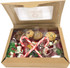 A kraft gift box containing mixed lollies, candy canes, and assorted cookies with a festive presentation.