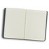 A soft cover notebook with a dark green exterior and blank lined pages opened to display its interior.