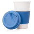 A ceramic coffee travel mug with a blue silicone sleeve and lid, featuring a simple design.
