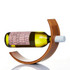 A wooden wine holder in a crescent shape supports a green wine bottle, showcasing its elegant design.