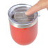 A reusable coffee cup in a vibrant red color with a silicone lid and a metallic band, featuring a finger pressing the lid.