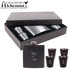 A drink bottle and four shot glasses in a gift box, featuring silver and black colours with a logo.