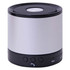 A compact silver speaker with a black base and control buttons, featuring a mesh top. It has a branding logo.