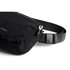 A black bum bag with a textured fabric surface and an adjustable strap, featuring a logo on the side.