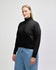 A black full-zip women's jacket made from French terry, featuring a fitted silhouette and high collar.