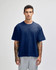 A navy unisex boxy T-shirt with short sleeves, paired with grey bottoms, featuring a branding logo.