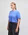 A blue cropped boxy T-shirt made of heavyweight cotton, featuring a relaxed fit and short sleeves.