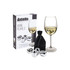 A set of four stainless steel wine pearls in a velvet pouch, displayed alongside a glass of white wine.